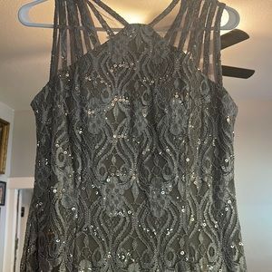 This was bought from Macys in the petite section. 55 inches long. Very comfy